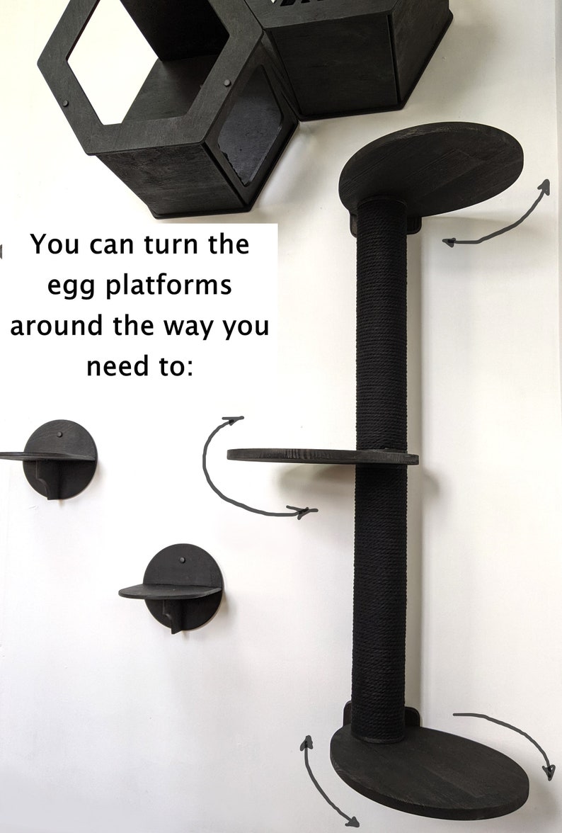 May include: Black cat tree with multiple platforms. The platforms are round and can be turned to face different directions. The text "You can turn the egg platforms around the way you need to." is visible in the image.