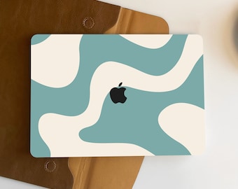 May include: A teal and white abstract swirl pattern laptop skin with the Apple logo in the center.