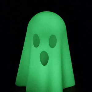 3d printed glow in the dark ghost. Comes with 1 battery operated color changing tealight. Glows in the dark or can use with tealight.