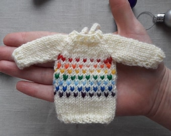 Christmas tree ornament. Tiny sweater. Gift tags.