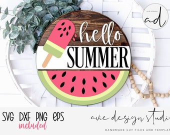 May include: A round wooden sign with the text "hello summer" in white script font. The sign is decorated with a watermelon slice and a red and green popsicle.