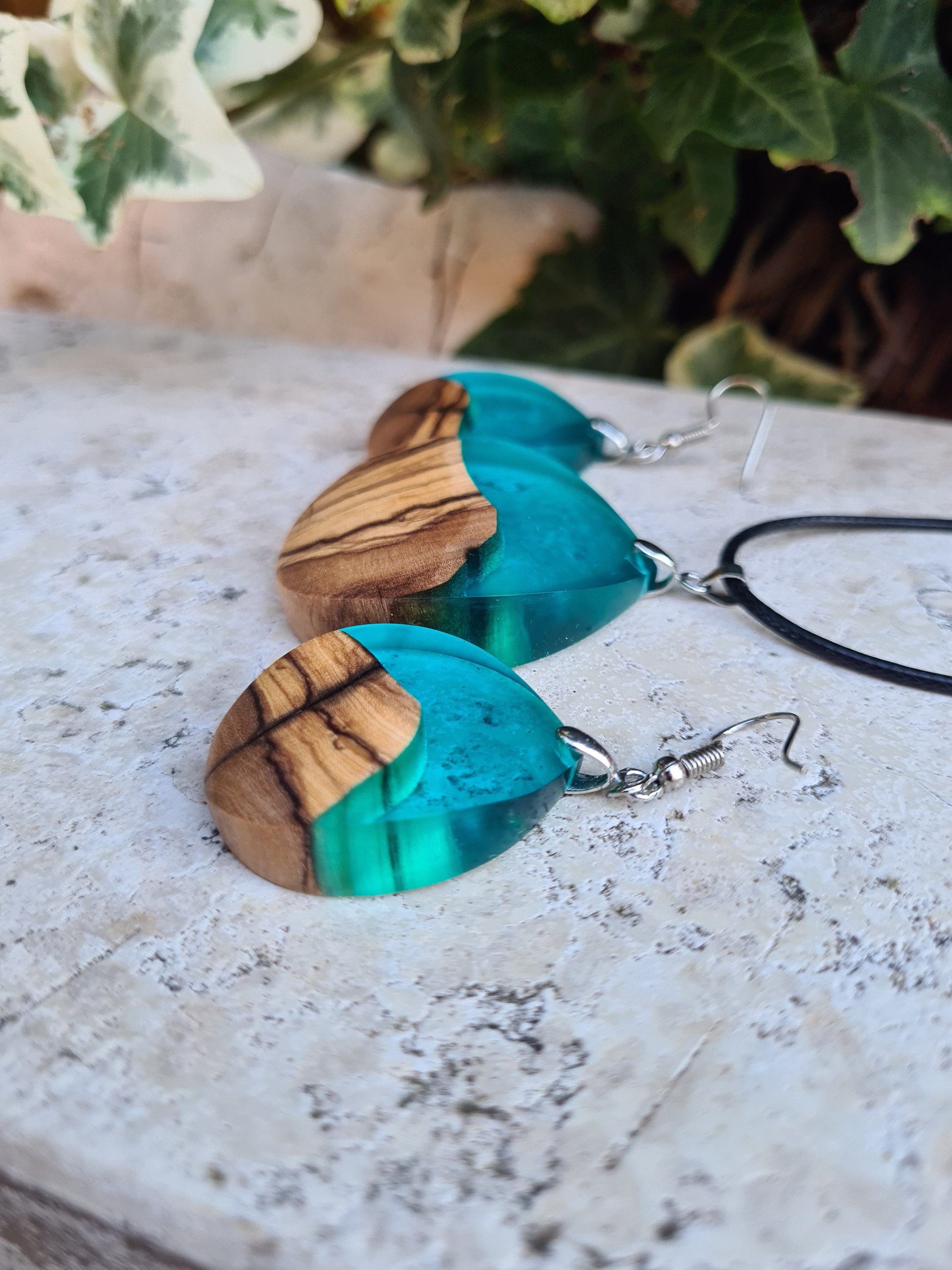 Unique jewelry set Earrings and necklace made of olive wood and resin in blue color.