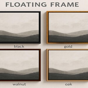 three black and white paintings hanging on a wall