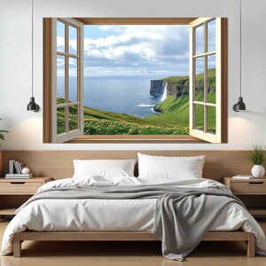 Fensteröffnung zu rauen Klippen in den Nordatlantik auf den Färöer-Inseln Leinwanddruck, Fenster mit Blick auf das Meer