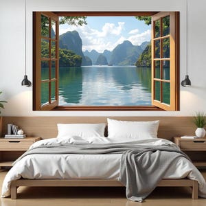 May include: A photo of a bedroom with a bed and two nightstands. The wall behind the bed has a large window with a view of a tropical island with mountains and water. The window is open and the curtains are drawn back.