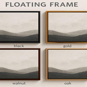 three black and white paintings hanging on a wall