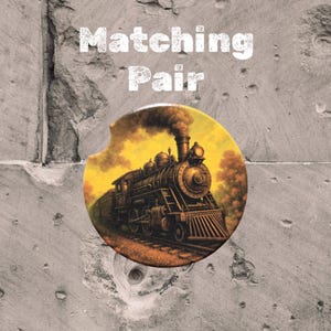 May include: A round car coaster with a vintage train illustration. The coaster features a detailed image of a steam engine train with a yellow and orange background. The words "Matching Pair" are above the coaster.