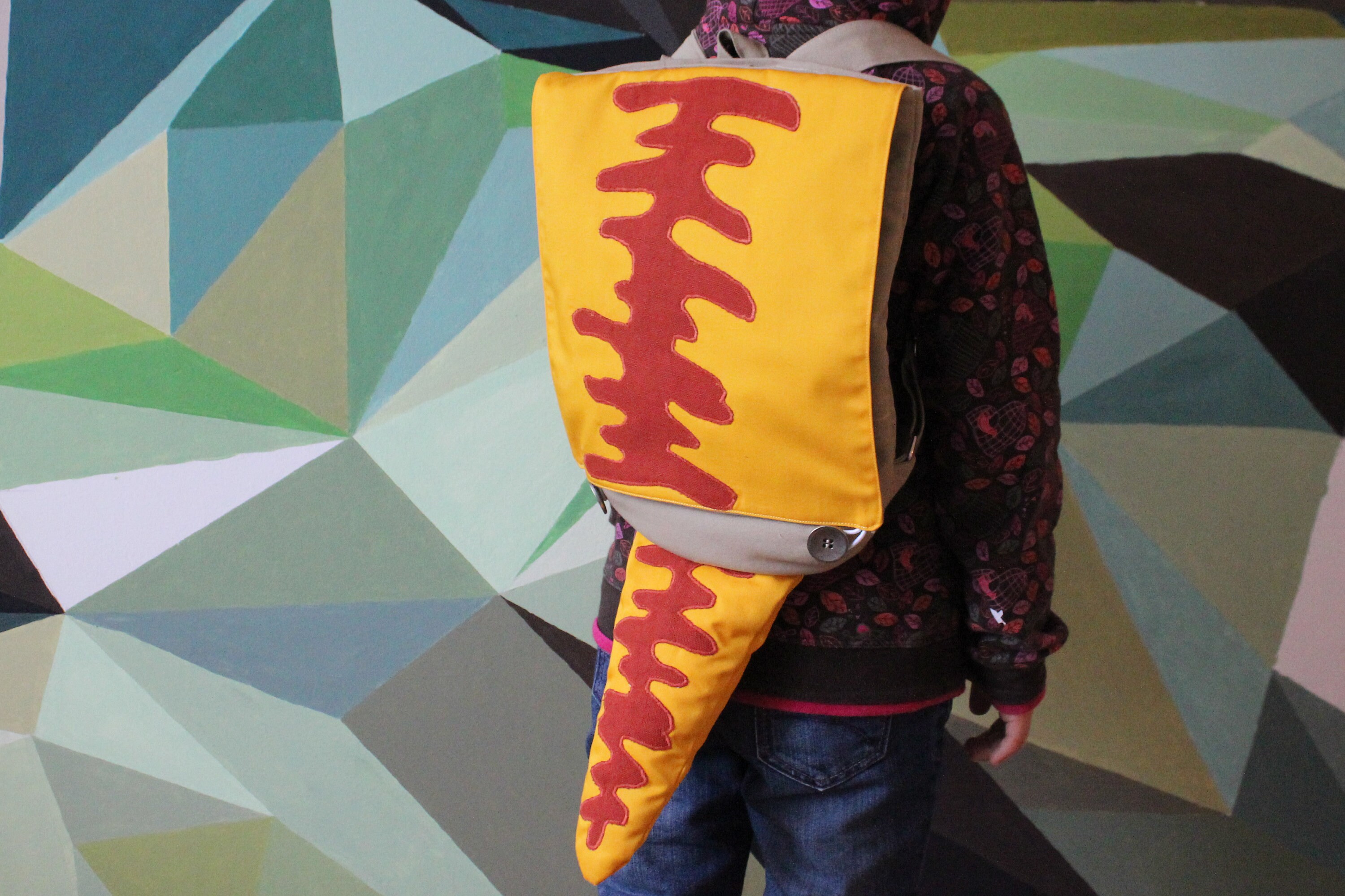 yellow triceratops backpack