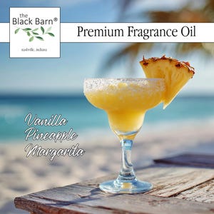 May include: A margarita cocktail in a stemmed glass, garnished with a pineapple wedge. The drink is yellow with a sugared rim. The text "Vanilla Pineapple Margarita" is visible. The background shows a beach scene.