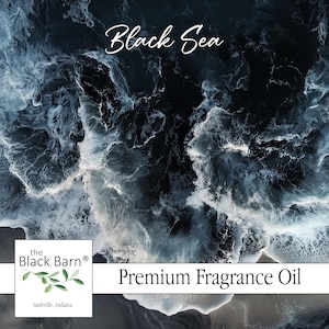 May include: Premium fragrance oil with a dark, swirling ocean wave design. The words "Black Sea" are written in cursive script. The Black Barn logo is in the lower left corner.