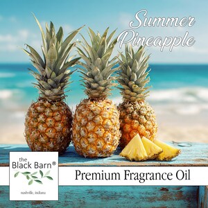 May include: Three ripe pineapples with spiky green tops and textured, golden-brown exteriors sit on a weathered blue surface. Sliced pineapple pieces are in front. The text "Summer Pineapple" and "Premium Fragrance Oil" are visible.