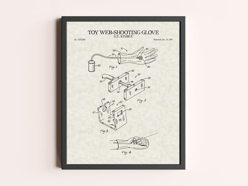 Peut inclure: Impression encadr&eacute;e d'un brevet de "Gant lanceur de toile" par S.E. Kimble. L'illustration en noir et blanc montre un gant avec des composants m&eacute;caniques, dont un r&eacute;servoir et un m&eacute;canisme de tir. L'impression est dans un cadre noir.