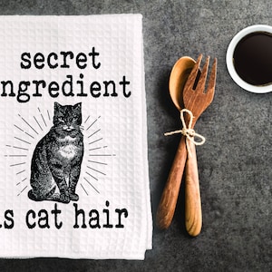 Funny inappropriate Halloween dish towel, kitchen towel. &quot; secret ingredient is cat hair &quot;