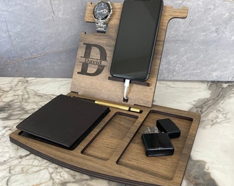 May include: A wooden valet tray with a phone stand, watch holder, and compartments for a wallet, pen, and lighter. The tray is personalized with the name "David".