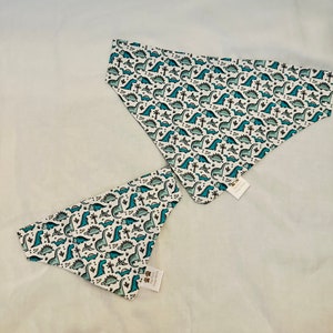 Teal Dinosaurs on white over the collar bandana