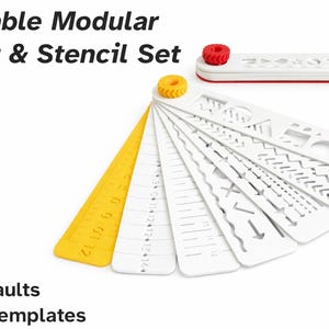 May include: Foldable modular ruler and stencil set. The set includes a yellow ruler, white stencils with various shapes and patterns, and a white and red case. Text on the image reads: Foldable Modular Ruler & Stencil Set, - 7 Defaults, - DIY Templates.