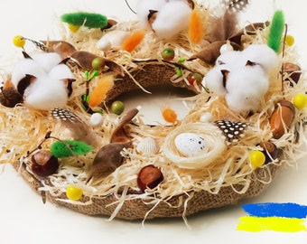 White Ostara table wreath with egg and dried herbs