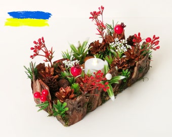 Red Ostara log candle holder in forest decoration