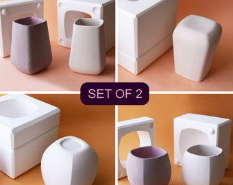 May include: Set of two ceramic molds for making two different styles of cups. One mold is square and the other is round. The molds are white and the cups are shown in both white and a light purple color. "SET OF 2" is written in purple text on a black background.