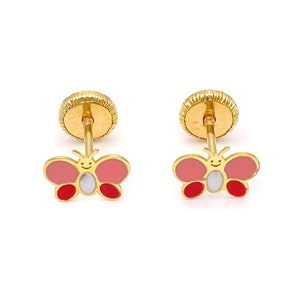 May include: A pair of gold butterfly earrings with pink and red enamel. The butterflies have a white face with a smiley face.