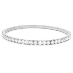 May include: A silver-toned stretch bracelet featuring a continuous row of small, round, clear faceted stones set in a metallic frame. The design is circular and flexible, composed of numerous identical segments that allow the band to expand.