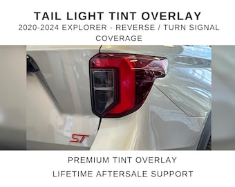 May include: A tail light tint overlay for a 2020-2024 Explorer, covering the reverse and turn signal sections. The vehicle is silver with a red ST emblem below the red and clear tail light assembly. Text reads: TAIL LIGHT TINT OVERLAY.