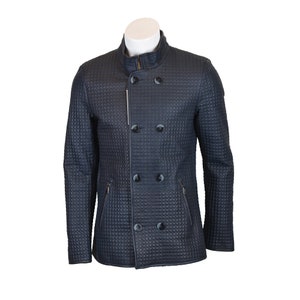 May include: A dark blue quilted jacket with a double-breasted closure and a zipper. The jacket has two zippered pockets on the front and a stand-up collar.