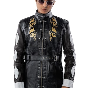 May include: A black leather jacket with gold embroidery and a belt. The jacket has a zipper closure and a stand-up collar.
