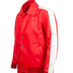 May include: A red jacket with a white stripe down the sleeve. The jacket has a collar, snap closures, and red ribbed cuffs and hem. The matching red pants have a white stripe down the side.