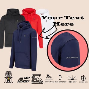 May include: A navy blue hooded sweatshirt with a pocket on the front. The sweatshirt has a small logo on the left sleeve and the text "James" embroidered on the right shoulder. The sweatshirt is shown with three other sweatshirts in black, red, and white.