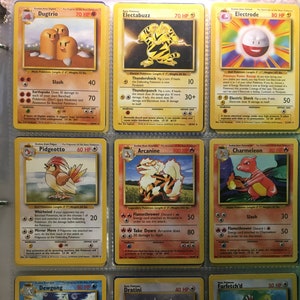 May include: A collection of Pokemon trading cards featuring various Pokemon characters, including Dugtrio, Electabuzz, Electrode, Pidgeotto, Arcanine, Charmeleon, Dewgong, Dratini, and Farfetch'd. The cards are in excellent condition and have vibrant colors.