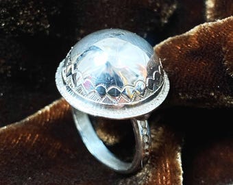 Tuareg dome ring in solid silver with a sand grain design and a bell