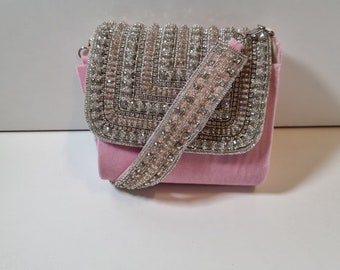 Baby pink clutch purse collection with silver diamonds.