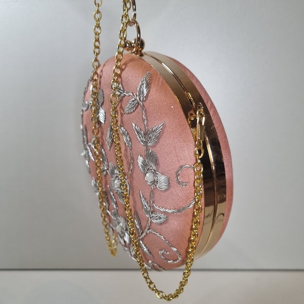 Peach, silver and gold round clutch purse collection with silver embroidery, gold casing and chain.