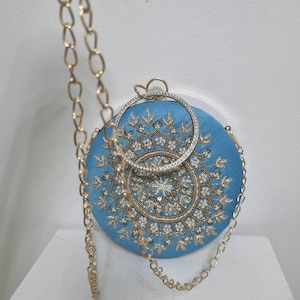 Turquoise blue round clutch purse collection.