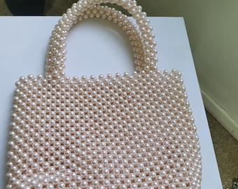 A beautiful handbag made of pearls.