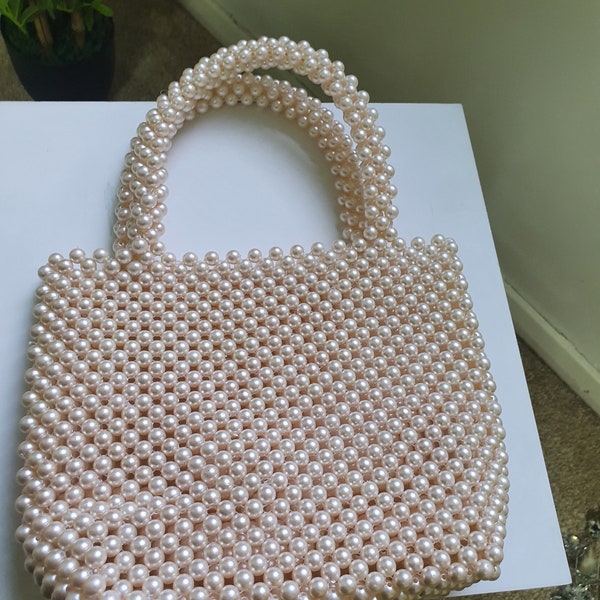 A beautiful handbag made of pearls.