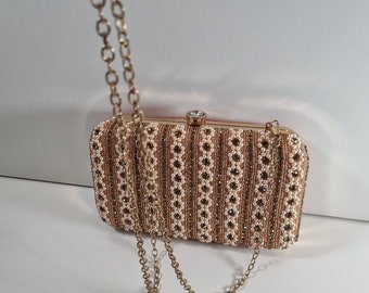 Our Pearl clutch purse collection. A beautiful design in pearl and gold.