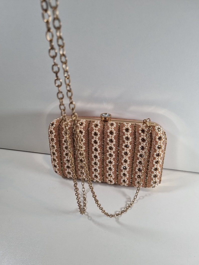 Our Pearl clutch purse collection. A beautiful design in pearl and gold. image 1