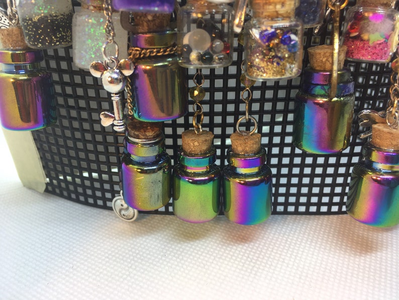 Tiny assortment of filled jars and charms