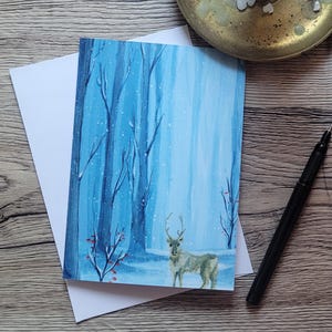 Tarjeta navideña de reno doblada Tarjeta navideña nórdica Ilustración escandinava Tarjeta de felicitación navideña acogedora Invierno