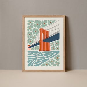 May include: A framed illustration of the Brooklyn Bridge in orange and blue with a green and blue floral pattern surrounding it.