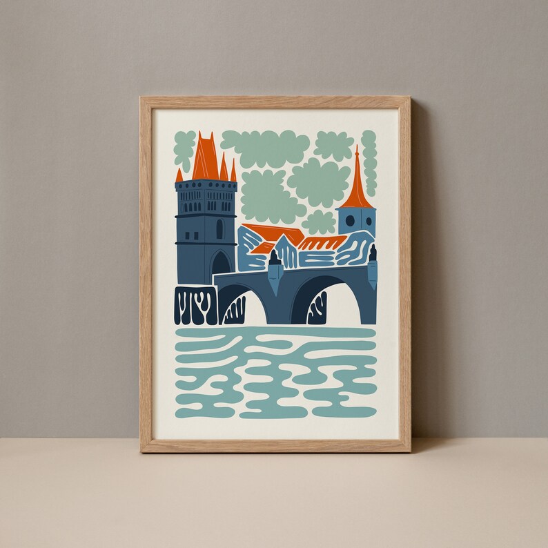 May include: A framed illustration of a bridge with a tower in the background. The bridge is blue and orange, and the tower is grey. The water is blue and green.
