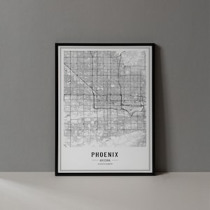 May include: Black and white map print of Phoenix, Arizona with the city name and coordinates at the bottom. The map is framed in a black frame.