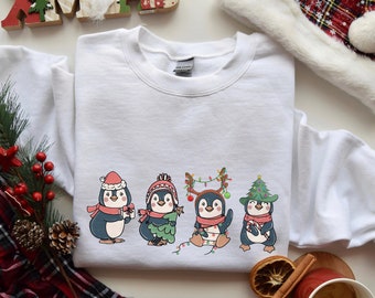 ペンギンのメリークリスマス スウェットシャツ、かわいいペンギンのクリスマス ライト セーター、クリスマス ペンギン愛好家シャツ、クリスマス ギフト、動物愛好家ギフト