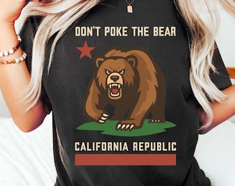 May include: Black t-shirt with the text "DON'T POKE THE BEAR" above a brown bear graphic. The bear is on green grass, and below is "CALIFORNIA REPUBLIC" in white text over a red rectangle.
