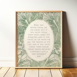May include: Wooden framed art print. The print has a green floral pattern and an oval with the text: "May you never steal, lie, or cheat...I couldn't live a day without you."