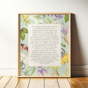 Print of Ralph Waldo Emerson Success poem written in a white center rectangle, surrounded by a background of light blue with vintage floral artwork. Pictured in a thin wood frame.