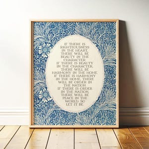May include: Framed art print featuring a blue and white floral pattern background. The artwork includes an oval-shaped text box with inspirational text. The frame is a light wood color, and the print is displayed on a wooden floor.
