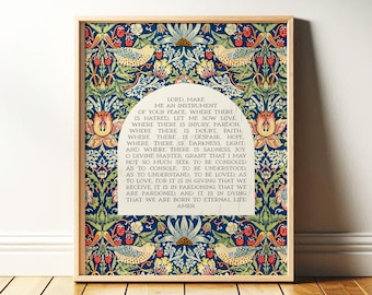 May include: A framed wall art print featuring a dark blue background with a repeating pattern of green leaves, orange flowers, and red berries. Centered is an arched cream-colored panel containing the text of the Prayer of Saint Francis.